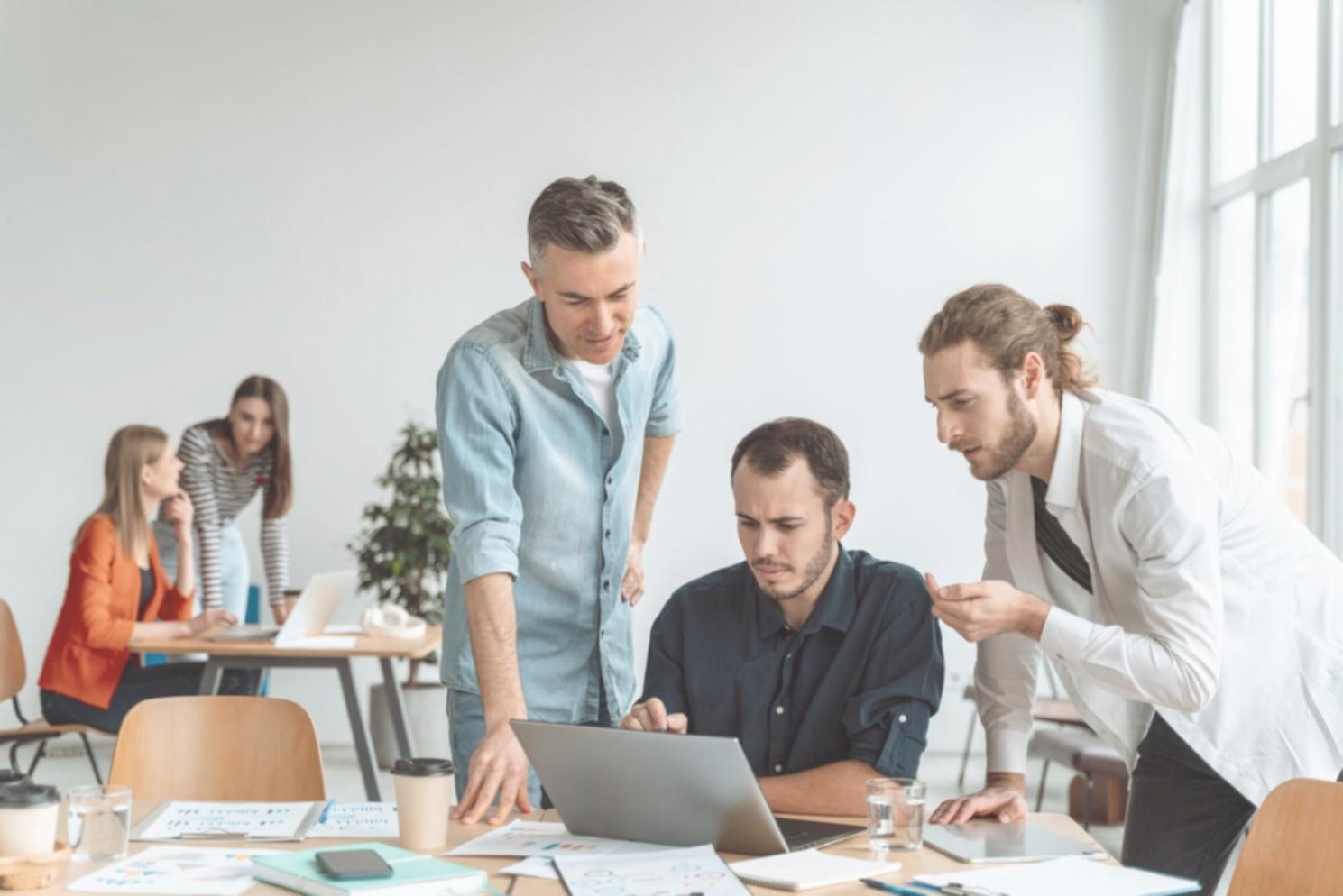 Financial professionals collaborating on automation systems